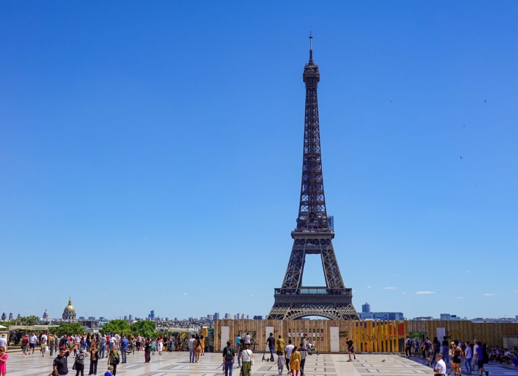 Eiffel Tower – Iconic Landmark and Top Tourist Attraction in Paris, France Eiffel Tower standing tall over Paris skyline with beautiful architecture and clear blue sky in the background
