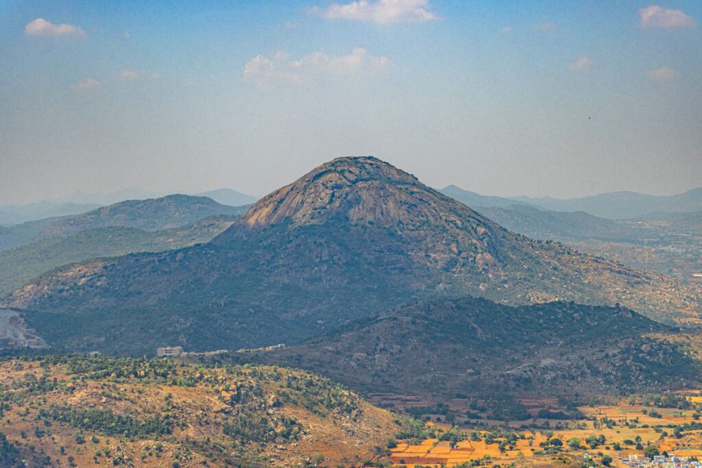 Nandi Hills – Popular Weekend Getaway from Bangalore Nandi Hills sunrise view with lush green hills and misty landscape near Bangalore